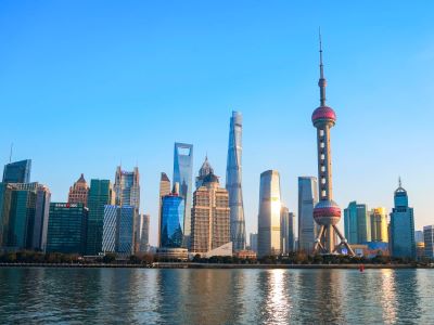 Daytime view of Oriental Pearl Tower, Shanghai Tower and skyscrapers across Huangpu River, iconic scenery seen from Shanghai Bund waterfront
